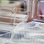 stack of clear plastic clamshell packaging